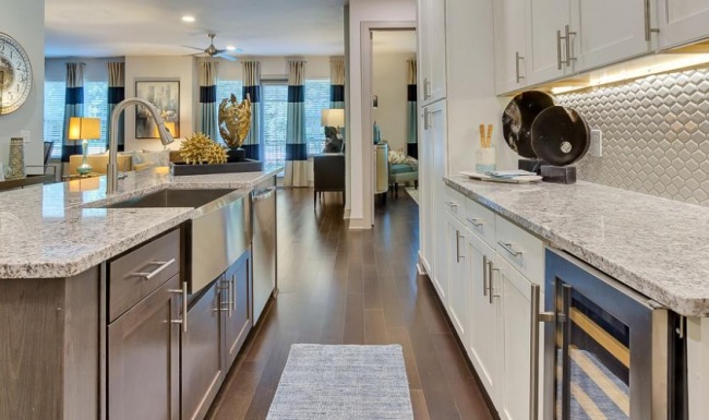a kitchen with white cabinets